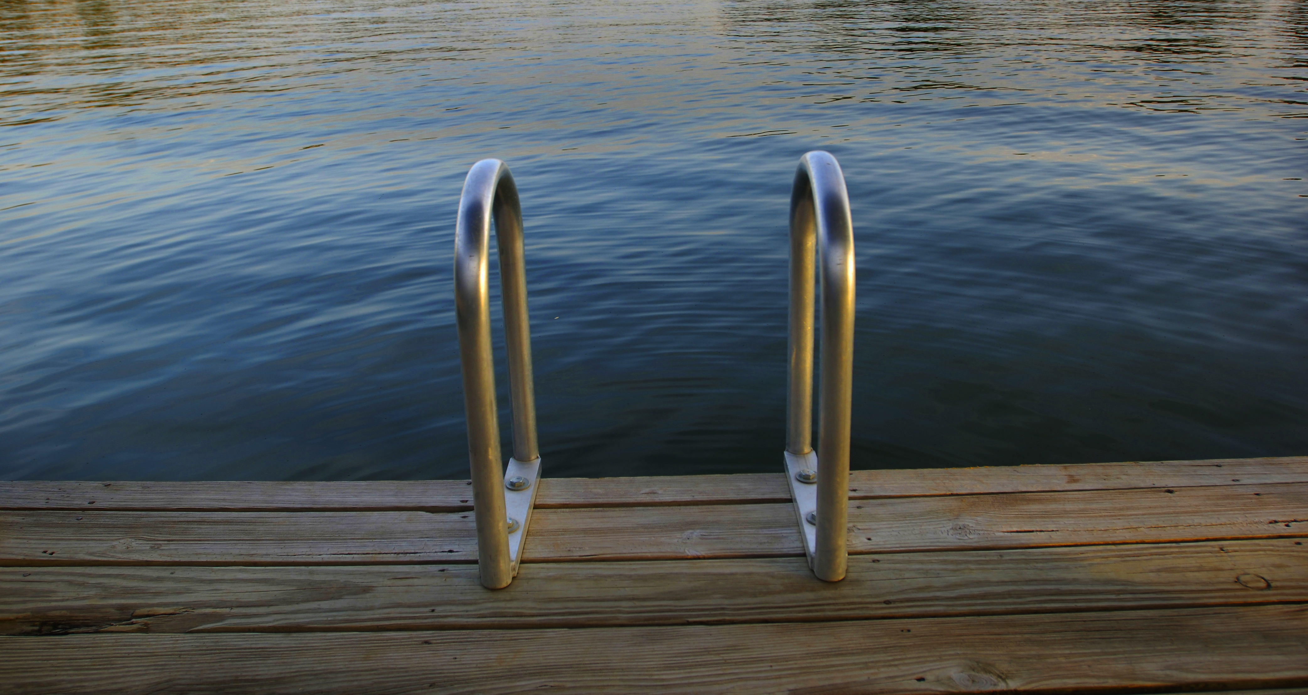 Inviting lakeside scene on Lake LBJ with calm water and morning light, fine art photograph