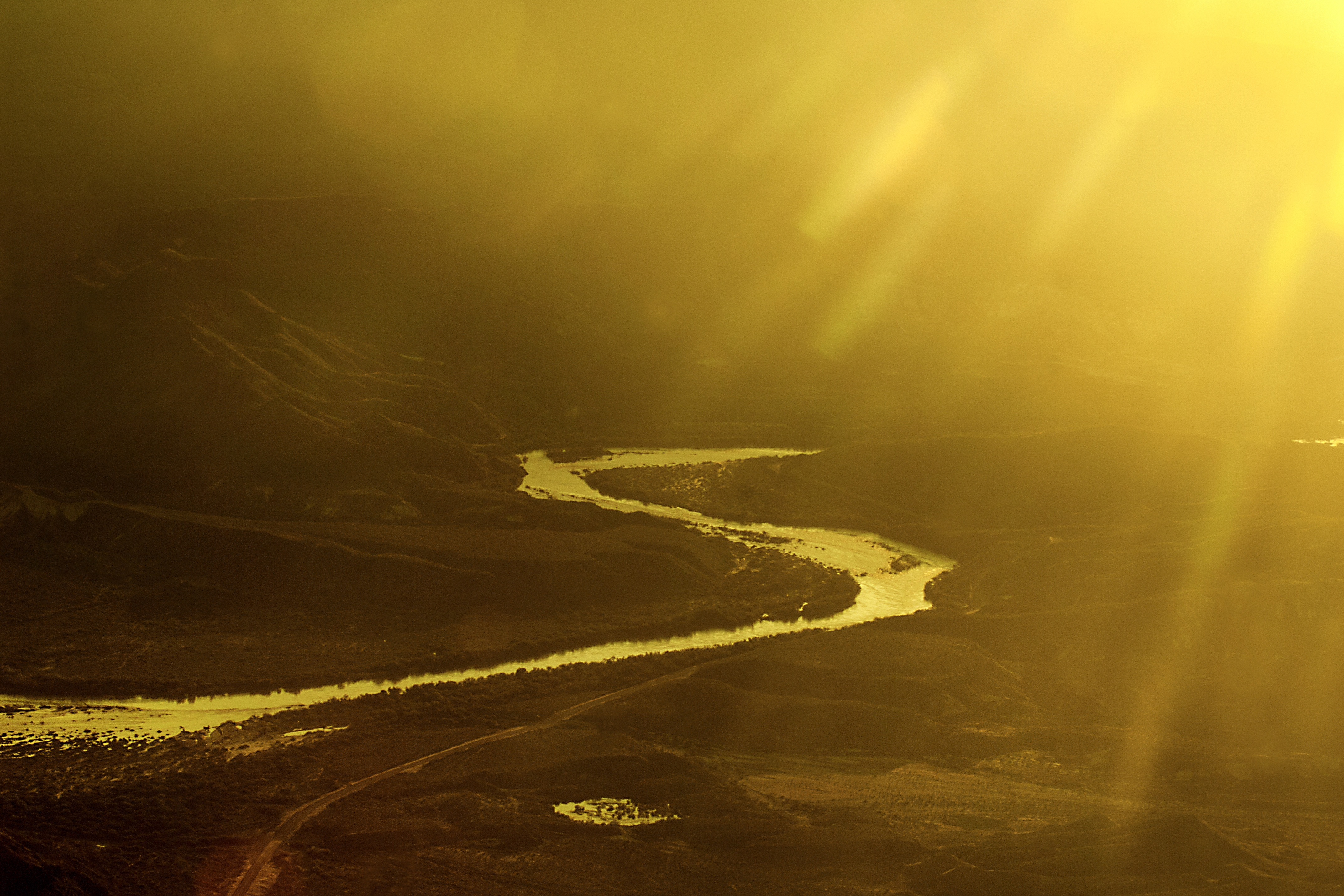 Aerial photograph of the Rio Grande River forming an S curve at the US Mexico border