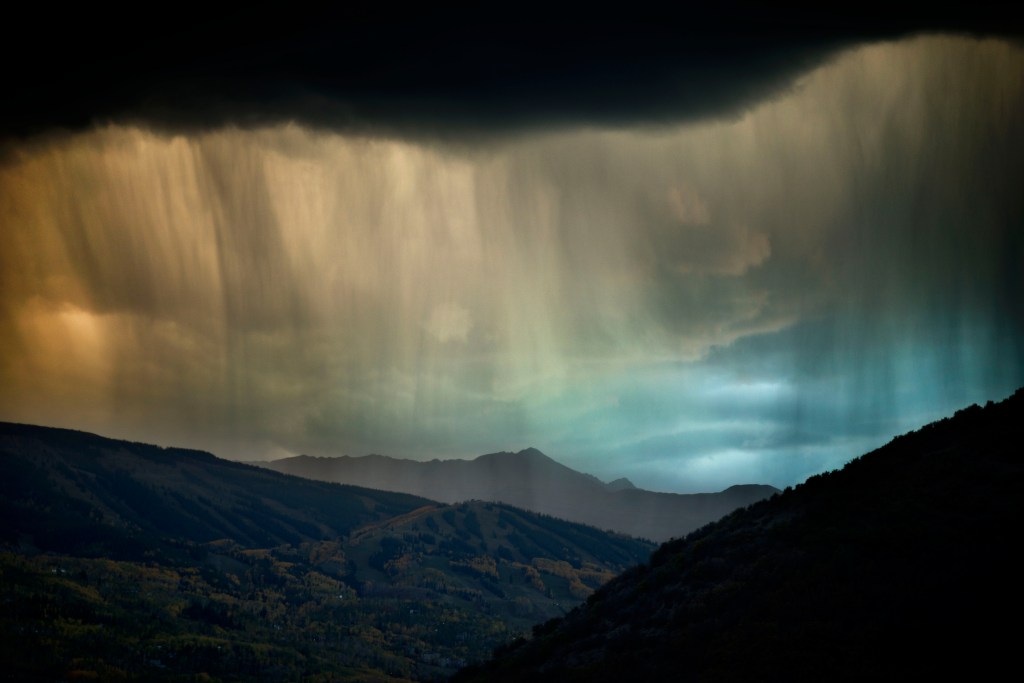 Abstract photograph of rain veiling a landscape, fine art nature image